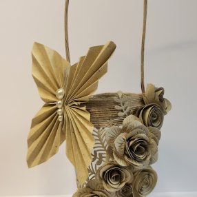 Decorative floral basket crafted from Paper Dienamics Grasstastic grass card featuring handmade paper roses and folded butterfly embellishment