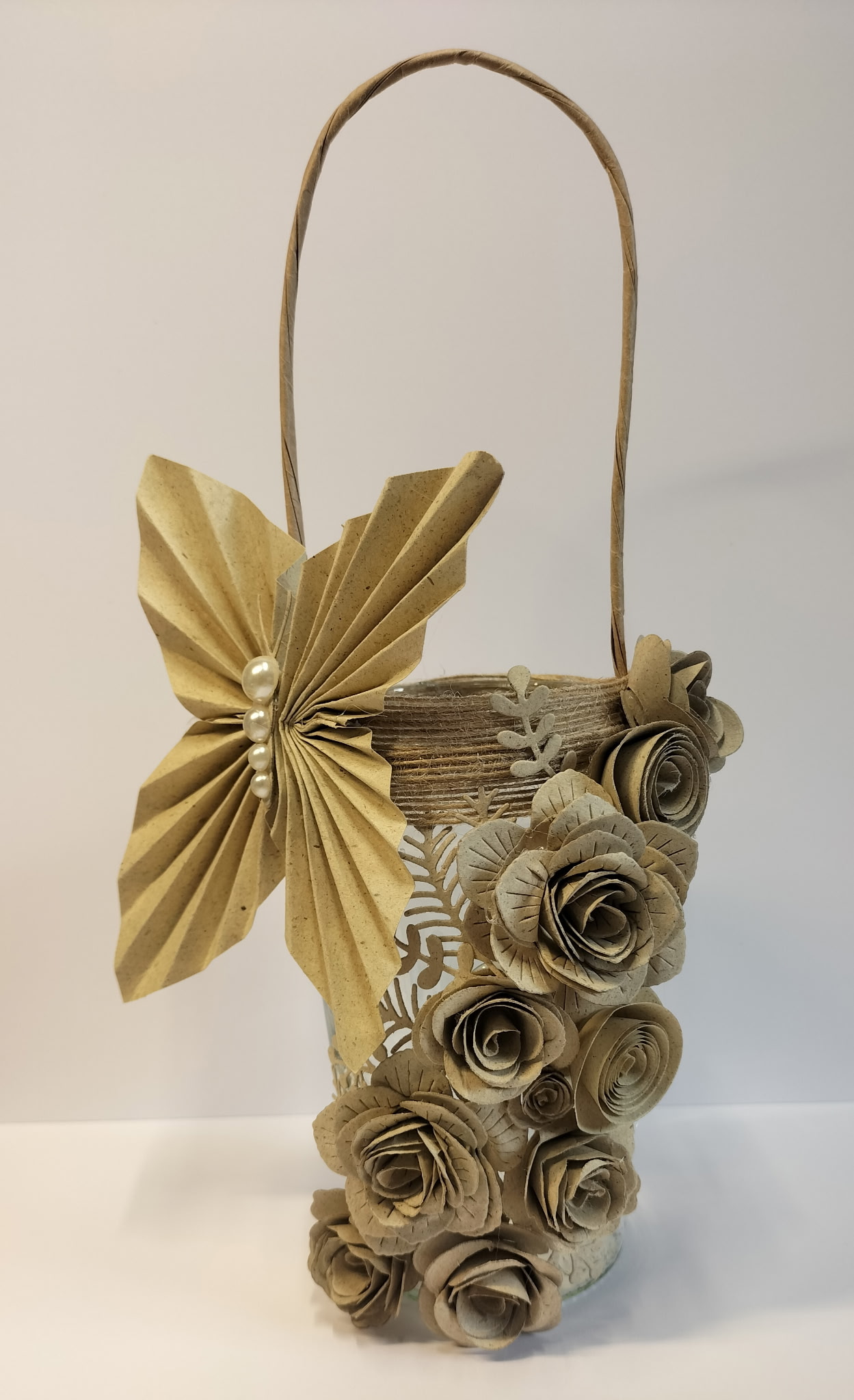 Decorative floral basket crafted from Paper Dienamics Grasstastic grass card featuring handmade paper roses and folded butterfly embellishment